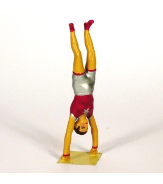 équilibriste faisant le poirier